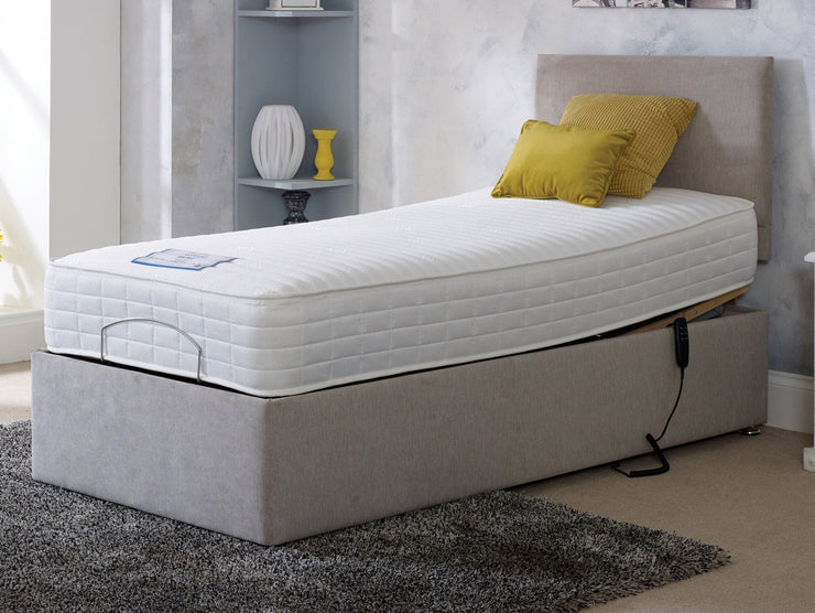 A cozy adjustable bed featuring a comfortable mattress and supportive box spring, perfect for a restful night's sleep.