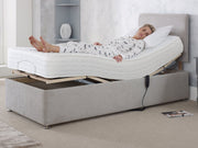 A woman lies comfortably on an adjustable bed, embracing a restful sleep on a cozy mattress.