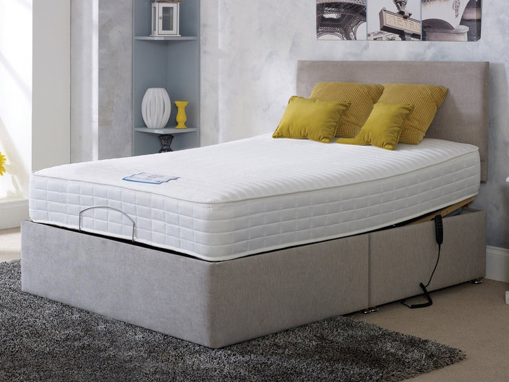 A cozy adjustable bed featuring a comfortable mattress and supportive box spring, perfect for a restful night's sleep.
