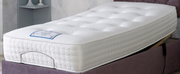 A cozy mattress resting on a vibrant purple bed, inviting comfort and relaxation.