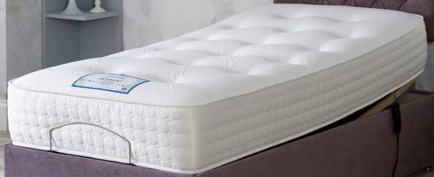 A cozy mattress resting on a vibrant purple bed, inviting comfort and relaxation.