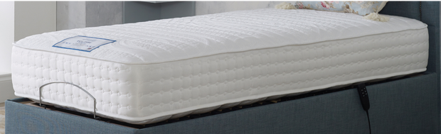 A cozy mattress resting on a vibrant blue bed, inviting comfort and relaxation.