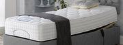 A cozy adjustable bed mattress topped with a fluffy pillow, ready for a restful night's sleep.